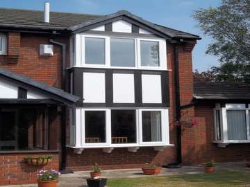 Mr & Mrs C. West Kirby, Wirral. Installtion of our 2800 Dekko Bay windows, double glazed with "A" rated sealed units. NEW Tudour board cladding to match existing timber profiles- Foiled PvcU with white PvcU Infill panels 